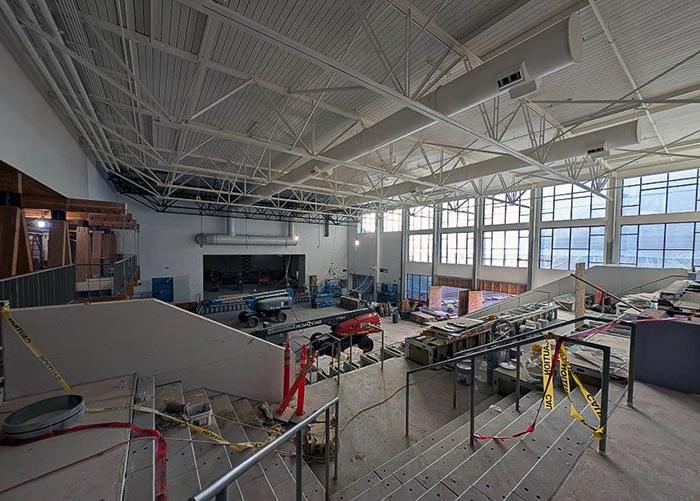 large room with wide stairs under construction